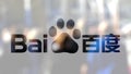Baidu logo on a glass against blurred crowd on the steet. Editorial 3D rendering Royalty Free Stock Photo