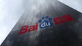 Baidu logo on a skyscraper facade reflecting clouds. Editorial 3D rendering