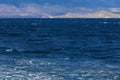 Baikal lake in December with with ice blocks in water