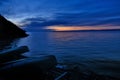 Baikal lake before sunrise in autumn with two inverted boats at the shore Royalty Free Stock Photo