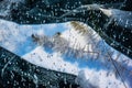 The Baikal Lake in winter with a surface covered with a thick layer of transparent ice with white. Baikal ice with frozen algae.