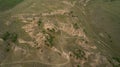 Baikal region. Dirt road on Tazheranskaya steppe near the stone rocks, called the Valley of the Stone Spirits. Aerial