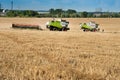 Baikivtsi, Ternopil Oblast, UKRAINE - August 10, 2020: the process of harvesting grain in the field, the sickle trailer is