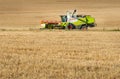 Baikivtsi, Ternopil region, UKRAINE - August 10, 2020: Wheat fields and harvester CLAAS Lexion , the end of the grain harvesting