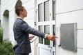 Bailiff Debt Collector Touching Doorbell. Confiscation Royalty Free Stock Photo