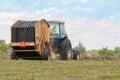 Bailing hay in the summer Royalty Free Stock Photo