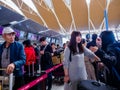 BAIYUN AIRPORT, GUANGZHOU, CHINA - 13 MAR 2019 -  Asian Chinese travellers / Passengers queue up to check-in before their flight Royalty Free Stock Photo