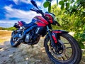 Bajaj 200cc Pulsar Bike. It is red and black in color.