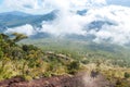 Bajawa - A couple going down a steep slopes of volcano Inierie