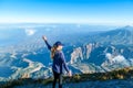 Bajawa - a girl standing on the top of the volcano, admiring the view