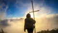 Bajawa - Girl standing on top of a volcano, surrounded by clouds Royalty Free Stock Photo