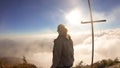 Bajawa - Girl standing on top of a volcano, surrounded by clouds Royalty Free Stock Photo