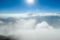 Bajawa - Sun shining above the clouds Royalty Free Stock Photo