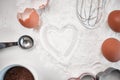Bake with love. baking powder dusted into a heart shape on a countertop after baking.