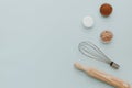 Bake tools set with ingredients on pastel background, top view