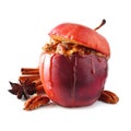 Baked apple with caramel, brown sugar and and nuts isolated on white Royalty Free Stock Photo