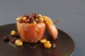 Baked apple with nuts and raisins Royalty Free Stock Photo