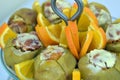 Baked apples with toppings and chopped oranges