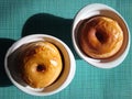 Baked apples in white bowls