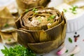 Baked artichokes cooked with garlic sauce