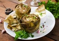 Baked artichokes cooked with garlic sauce