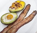 Baked avocado with eggs , cheese and bacon