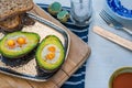 Baked avocado with quail eggs Royalty Free Stock Photo