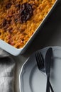 Baked bean casserole on a white linen tablecloth Royalty Free Stock Photo