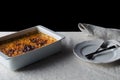 Baked bean casserole on a white linen tablecloth Royalty Free Stock Photo