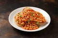 Baked beans on toast in tomato sauce on white plate Royalty Free Stock Photo