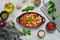 Baked beans in tomato sauce on a black stone plate. Royalty Free Stock Photo