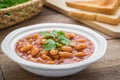 Baked beans in tomato sauce on plate and toast Royalty Free Stock Photo