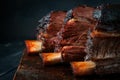 Baked beef brisket on the ribs smoked with a dark crust on a wooden Board. Classic Texas barbecue Royalty Free Stock Photo