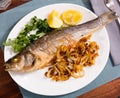 Oven baked sea bass fish Royalty Free Stock Photo