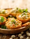Baked bread cups filled with vegetable and mayonnaise salad.