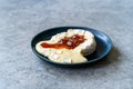 Baked Brie Cheese Dessert with Strawberry Jam. Marmalade Melted Camembert Royalty Free Stock Photo