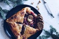 Baked brie cheese and cranberry puff pastry. Homemade puff pastry baking, sweet-savory taste, gourmet appetizer.