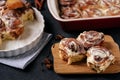 Baked Buns on Wooden Cut Board and Baking Dish