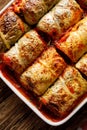 Baked cabbage rolls stuffed with groats and mushrooms in tomato sauce in a casserole dish Royalty Free Stock Photo