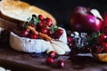 Melting baked Camembert Brie cheese with a cranberry honey and nut relish Royalty Free Stock Photo