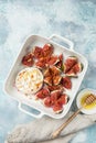 Baked camembert cheese and figs with walnuts and honey Royalty Free Stock Photo