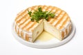 Baked camembert cheese on white background