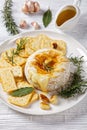 Baked camembert french soft cheese on white plate