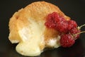 Baked camembert with raspberry coulis Royalty Free Stock Photo