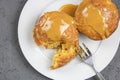 Baked caramel puddings on plate top view with creamy sauce Royalty Free Stock Photo