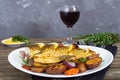 Baked carp with vegetables grilled on a white plate Royalty Free Stock Photo