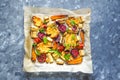 Baked carrots, beets, potatoes, zucchini and tomatoes on a baking sheet, top view food Royalty Free Stock Photo