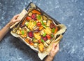 Baked carrots, beets, potatoes, zucchini and tomatoes on a baking sheet, top view food Royalty Free Stock Photo