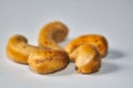 Baked cashew nuts on a white surface