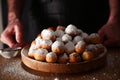 Baked castagnole. Traditional sweet pastries during the carnival period in italy. Street food, round biscuits with sugar